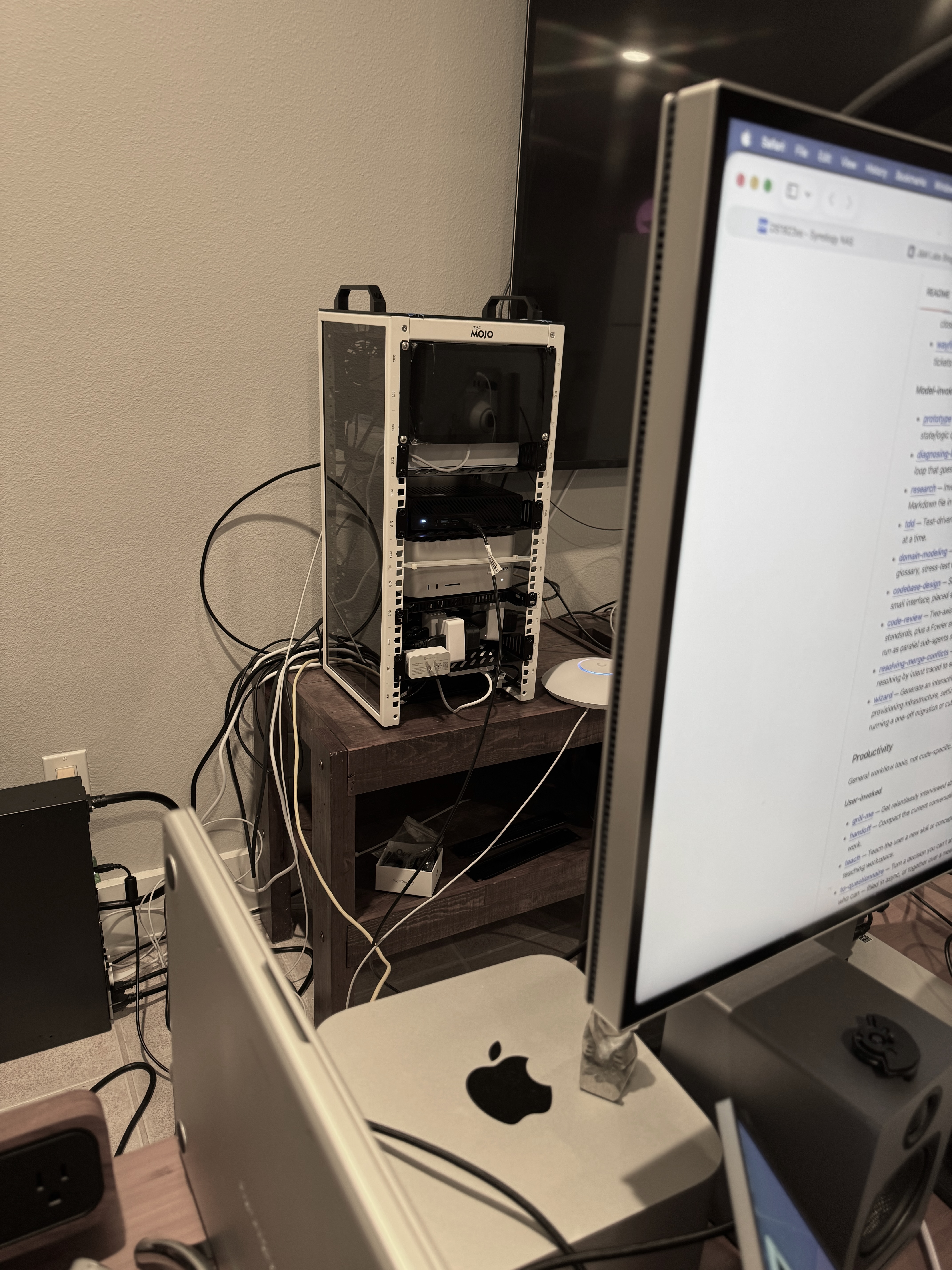 Wide view of the J&M Labs equipment rack with Macs, mini computers, cabling, and ThirdReality smart plugs installed below.