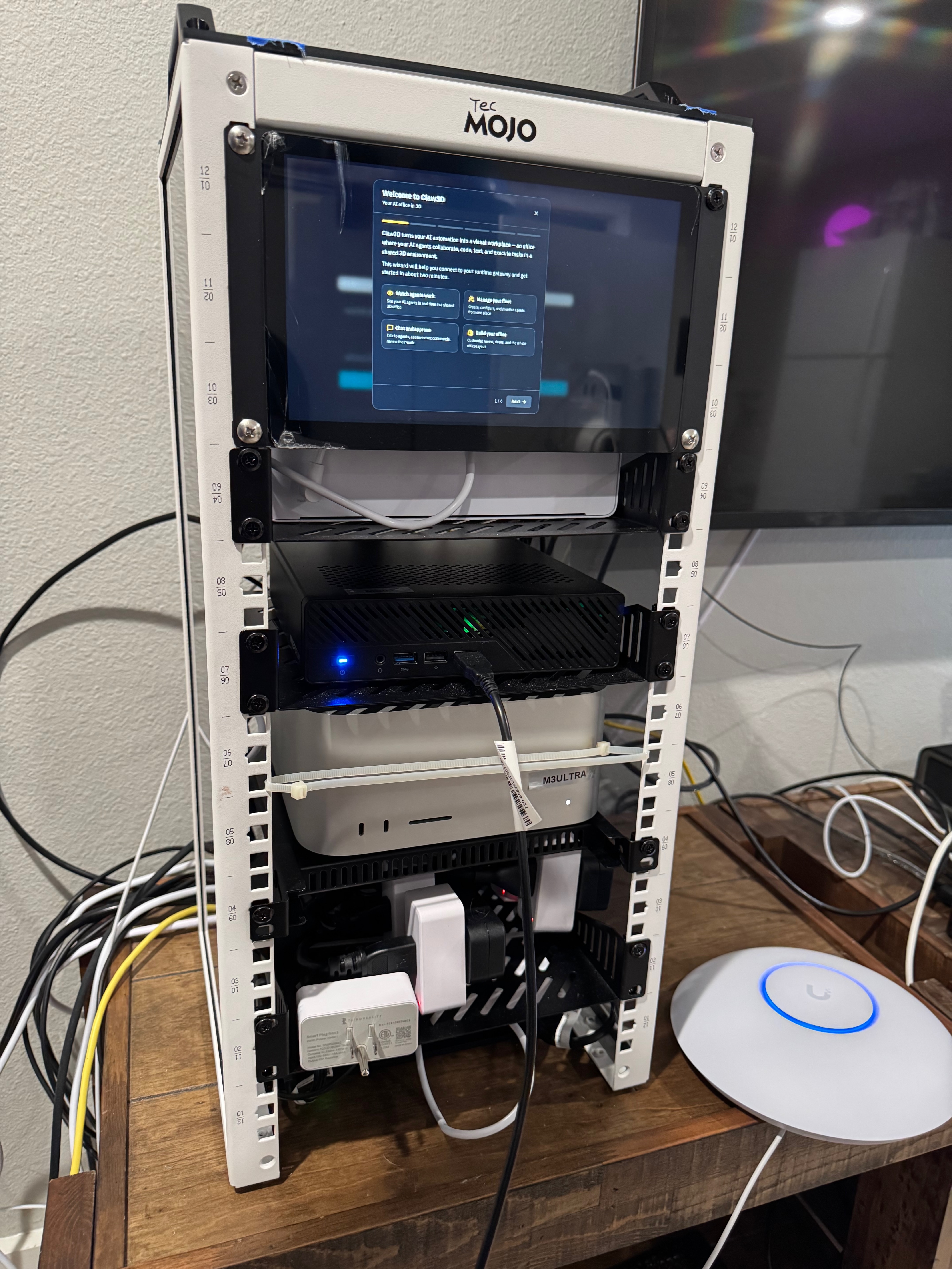 J&M Labs rack with multiple computers and smart plugs installed among the power connections.