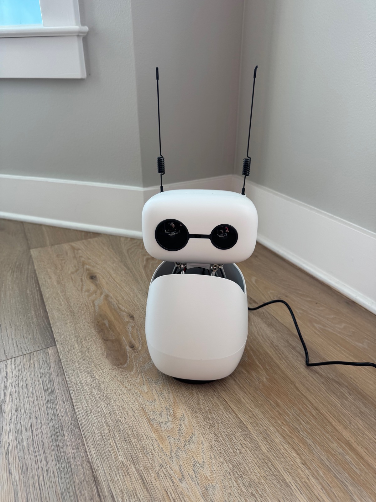 Fully assembled Reachy Mini standing on the floor