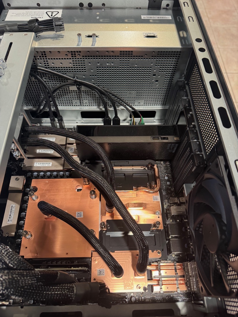 RTX PRO 4000 SFF in the Station's double-wide slot, next to the GB300's copper cold plates